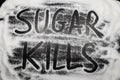 Words Sugar kills written in and with sugar grains, sugar health