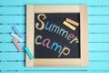 Words SUMMER CAMP written with colorful chalk