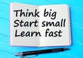 The words Think big Start small Learn fast on notebook Royalty Free Stock Photo