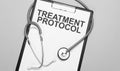 The words treatment protocol is written on white paper on a grey background near a stethoscope. Medical concept