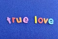 The words true love in colorful letters