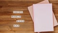 Words happy world book day made of wooden blocks with stack of books. Background for book holiday on wooden table top