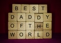 Words written on wood blocks: best daddy of the world. Happy Fathers Day Concept.