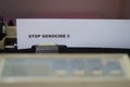 the words & x22;stop genocide& x22; on the printer paper Royalty Free Stock Photo