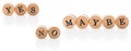 Words Yes No Maybe from circular wooden tiles with letters children toy.