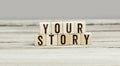 Words Your Story on wood cubes Royalty Free Stock Photo