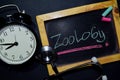Zoology handwriting on chalkboard on top view. Royalty Free Stock Photo