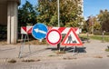 Work ahead construction site warning sign with road barricades and traffic caution barriers on the street Royalty Free Stock Photo