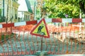 Work ahead street reconstruction site with sign and fence as road barricade Royalty Free Stock Photo