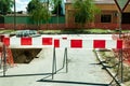 Work ahead street reconstruction site with sign and fence as road barricade Royalty Free Stock Photo