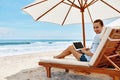 Work At Beach. Business Woman Working Online On Laptop Outdoors Royalty Free Stock Photo