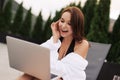 Work At Beach. Successful Business Woman Working Online In Internet Using Laptop Computer Outdoors. Girl Typing On Keyboard While Royalty Free Stock Photo