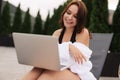 Work At Beach. Successful Business Woman Working Online In Internet Using Laptop Computer Outdoors. Girl Typing On Keyboard While Royalty Free Stock Photo