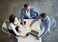 They work better together. High angle shot of three businesspeople working in the office. Royalty Free Stock Photo