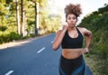 Work on bettering yourself each day. a young woman out for her morning run.