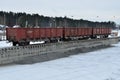 Unloading of crushed stone a railway car of a dump truck, closeup. Unloading bulk cargo from railway wagons