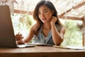 Work At Cafe. Woman With Laptop Working Remotely On Summer Vacation At Tropical Country Royalty Free Stock Photo