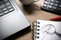 Work with calculator, laptop, pen and cup of coffee on the wooden table Royalty Free Stock Photo
