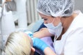 Work of a children`s dentist. Doctor`s hands in protective gloves. Concept of health care and disease prevention. Dental equipme Royalty Free Stock Photo