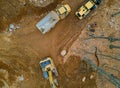The work of construction equipment in the production of earthworks on dump trucks with excavators Royalty Free Stock Photo