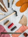 Work desk of clobber. Skin and tools on grey wooden desk background top view