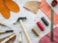 Work desk of clobber. Skin and tools on grey wooden desk background top view