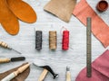 Work desk of clobber. Skin and tools on grey wooden desk background top view