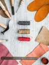 Work desk of clobber. Skin and tools on grey wooden desk background top view