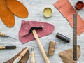 Work desk of clobber. Skin and tools on grey wooden desk background top view