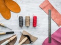 Work desk of clobber. Skin and tools on grey wooden desk background top view