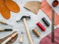 Work desk of clobber. Skin and tools on grey wooden desk background top view