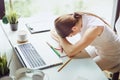 Work is done coffee break. Overworked and tired young business woman sleeping on desk at work in her office Royalty Free Stock Photo