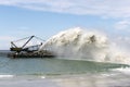 Work dredger dredging with sand washing on beaches. Special dredging hose for sand to create new land. Sand washing on sea Royalty Free Stock Photo