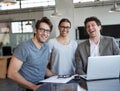 Work is easy when you enjoy your job. Portrait of three business colleagues in the office. Royalty Free Stock Photo