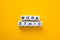 Work ethic words on yellow background