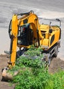 Excavating machine on construction site Royalty Free Stock Photo