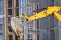 Excavating machine on construction site Royalty Free Stock Photo