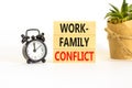 Work-family conflict symbol. Concept words Work-family conflict on wooden block on a beautiful white table white background. Black Royalty Free Stock Photo