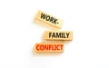 Work-family conflict symbol. Concept words Work-family conflict on wooden block on a beautiful white table white background. Royalty Free Stock Photo