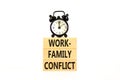 Work-family conflict symbol. Concept words Work-family conflict on wooden block on a beautiful white table white background. Black Royalty Free Stock Photo