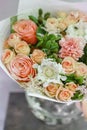 Work florist. Beautiful spring bouquet. Arrangement with mix flowers. The concept of a flower shop, a small family Royalty Free Stock Photo