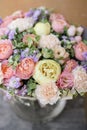 Work florist. Beautiful spring bouquet. Arrangement with mix flowers. The concept of a flower shop, a small family Royalty Free Stock Photo