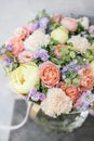 Work florist. Beautiful spring bouquet. Arrangement with mix flowers. The concept of a flower shop, a small family Royalty Free Stock Photo