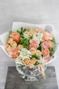 Work florist. Beautiful spring bouquet. Arrangement with mix flowers. The concept of a flower shop, a small family Royalty Free Stock Photo