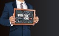 Work form Home words collage in businessman hands Royalty Free Stock Photo