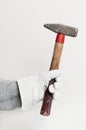 Work glove holding hammer Royalty Free Stock Photo