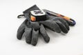 Work gloves with a flexometer and a cutter Royalty Free Stock Photo