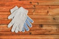 Work gloves on wooden background. Copy space.