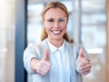 Work so good deserves a double like. Portrait of a mature businesswoman showing thumbs up in a modern office. Royalty Free Stock Photo