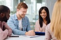 Joyful bearded man that looking at paper